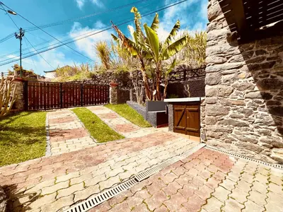 a brick walkway in front of a house at Typical House -Madeira Inn Group in Calheta