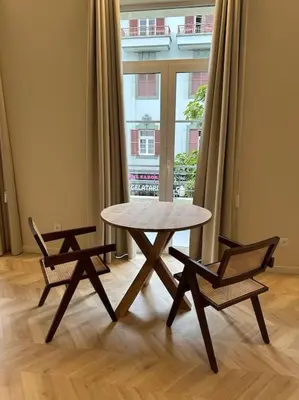 a table and two chairs in front of a window at Downtown collection apartments in Funchal