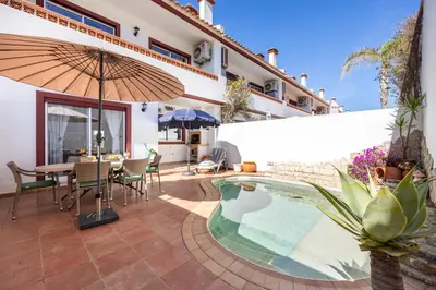 a white house with a red fence at CoolHouses Algarve Burgau, 3 Bed w/ plunge pool, close to village centre, Casa Boa Vida in Luz
