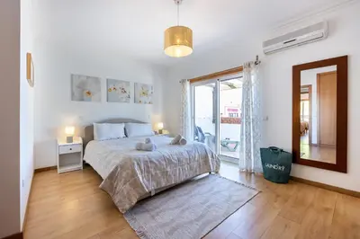 a bedroom with a bed and a dresser in it at CoolHouses Algarve Burgau, 3 Bed w/ plunge pool, close to village centre, Casa Boa Vida in Luz