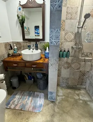 a bathroom with a sink and a shower at CASA BOHO your happy place in Calheta in Calheta