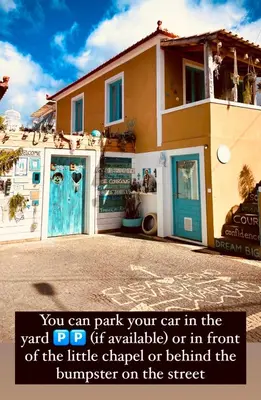 a house with a sign in front of it at CASA BOHO your happy place in Calheta in Calheta