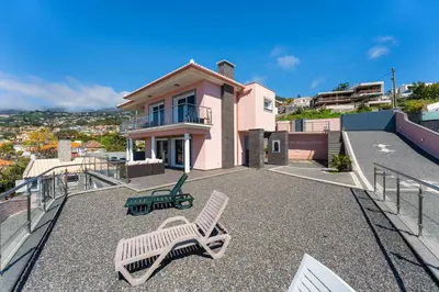 a house with two chairs on a roof at FLH Funchal House with Sea View in Funchal