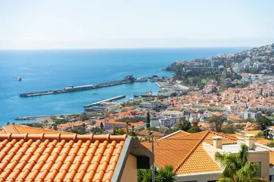 a view of the city of dubrovnik and the ocean at FLH Funchal House with Sea View in Funchal