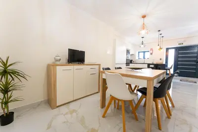 a kitchen and dining room with a table and chairs at FLH Santa Cruz Triplex with Terrace in Santa Cruz