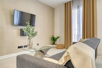 a living room with a couch and a glass table at Beco Santa Emilia 2F, a Home in Madeira in Funchal