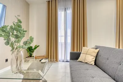 a living room with a couch and a glass table at Beco Santa Emilia 2F, a Home in Madeira in Funchal