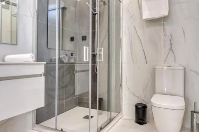 a bathroom with a shower and a toilet at Beco Santa Emilia 3M, a Home in Madeira in Funchal