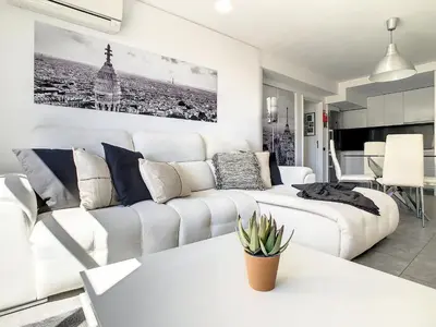 a white living room with a white couch at Ocean Breeze by LovelyStay in Funchal