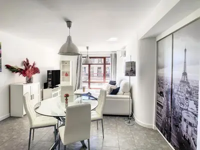 a living room with a table and a couch at Ocean Breeze by LovelyStay in Funchal