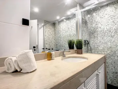 a bathroom with a sink and a shower at Ocean Breeze by LovelyStay in Funchal