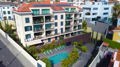 an aerial view of a building with a swimming pool at Sunlight Apartment by LovelyStay in Funchal