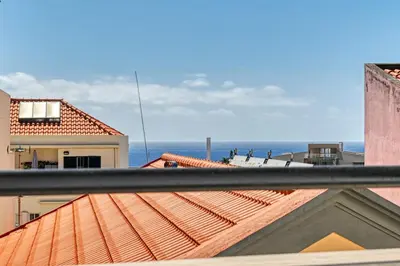 a view of the ocean from a roof at Beco Santa Emilia 4Q, a Home in Madeira in Funchal