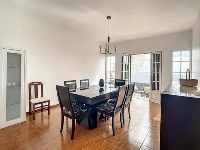 a kitchen and dining room with a table and chairs at Villa Formosa View by Atlantic Holiday in Funchal