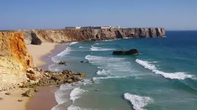 an aerial view of a beach with cliffs and the ocean at Quarto Antigo in Pedralva