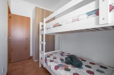 a bedroom with two bunk beds in a room at Casa 7 Gerações in Sagres