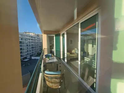 a balcony with a desk and a chair on it at Horizon Dream in Funchal