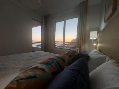 a bedroom with a bed with a view of the ocean at Horizon Dream in Funchal