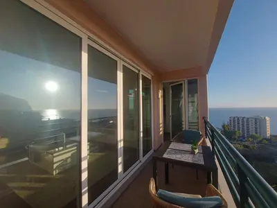 a balcony with a table and a view of the ocean at Horizon Dream in Funchal