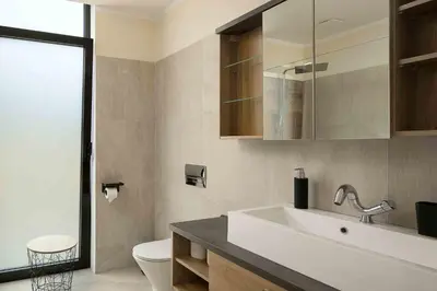 a bathroom with a sink and a toilet at Villa Ohana in Estreito da Calheta