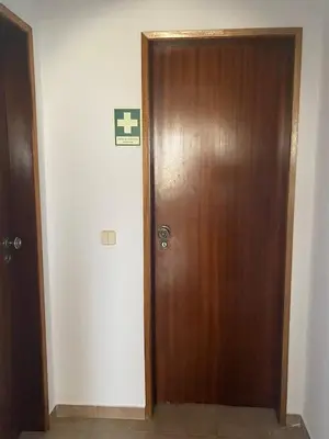 a wooden door in a room with a sign on it at Villa Mourisca in Aljezur