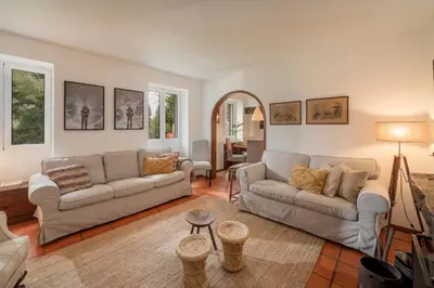 a living room with two couches and a table at Casa da Cebola by An Island Apart in Santa Cruz