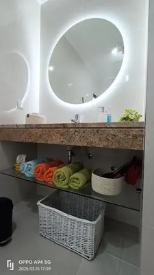 a bathroom with a sink and a mirror at Suite Palms in Funchal