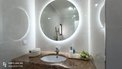 a bathroom with a sink and a mirror at Suite Palms in Funchal