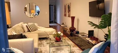 a living room with a couch and a table at Suite Palms in Funchal
