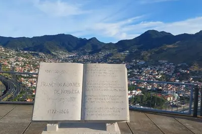 a book sitting on top of a mountain at Viewpoint Machico - Lovely Nature View in Machico