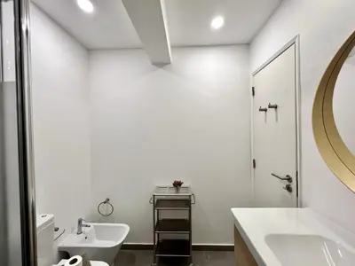 a white bathroom with a sink and a toilet at Lagos Ocean Breeze 1 by Homing in Lagos