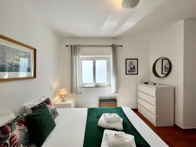 a bedroom with a bed with two pillows on it at Lagos Ocean Breeze 1 by Homing in Lagos