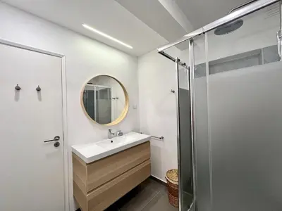 a bathroom with a sink and a mirror at Lagos Ocean Breeze 1 by Homing in Lagos
