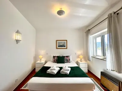 a bedroom with a bed with two towels on it at Lagos Ocean Breeze 1 by Homing in Lagos