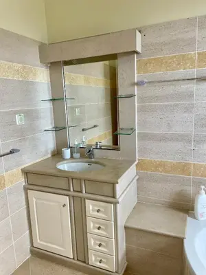 a bathroom with a sink and a mirror at Belle Vue in São Jorge