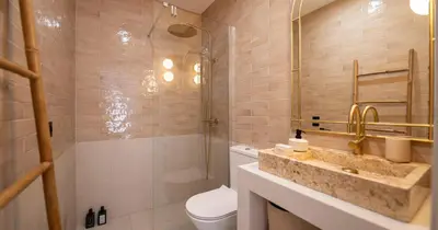 a bathroom with a sink and a toilet and a shower at Az Ribat Sea e Sun in Aljezur