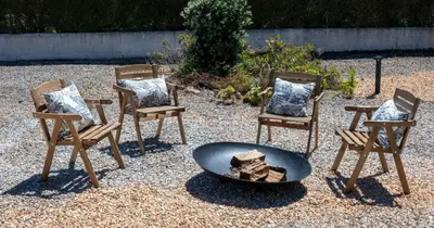 a group of chairs and a fire pit in a yard at Az Ribat Sea e Sun in Aljezur