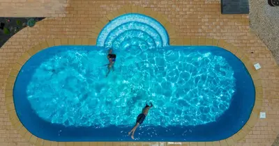 a person swimming in a swimming pool in a swimming pool at Az Ribat Sea e Sun in Aljezur