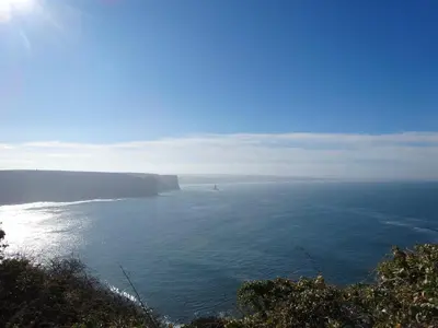 a large body of water with a boat in the distance at Casa Lady D'Avila in Aljezur