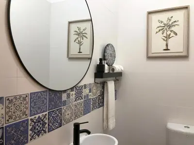 a bathroom with a mirror and a sink at Casa DaSa by LovelyStay in Salão