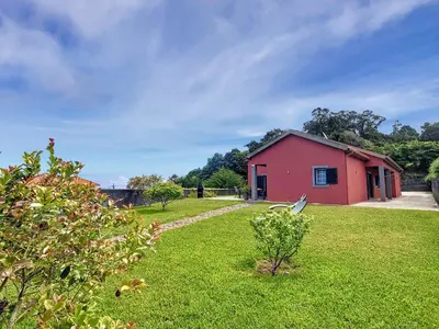 a red building in a yard with a grass field at Casa DaSa by LovelyStay in Salão